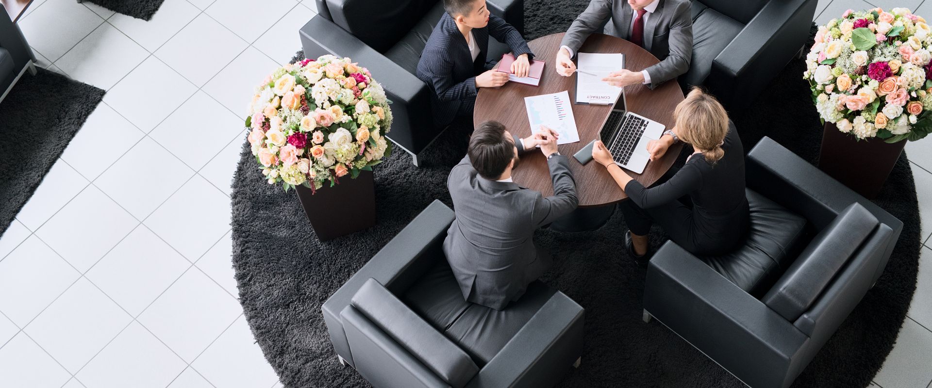 High angle view of business people cooperating during a meeting